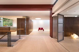 living room and entrance hall with dinesen wood floor, folding partition and skylights