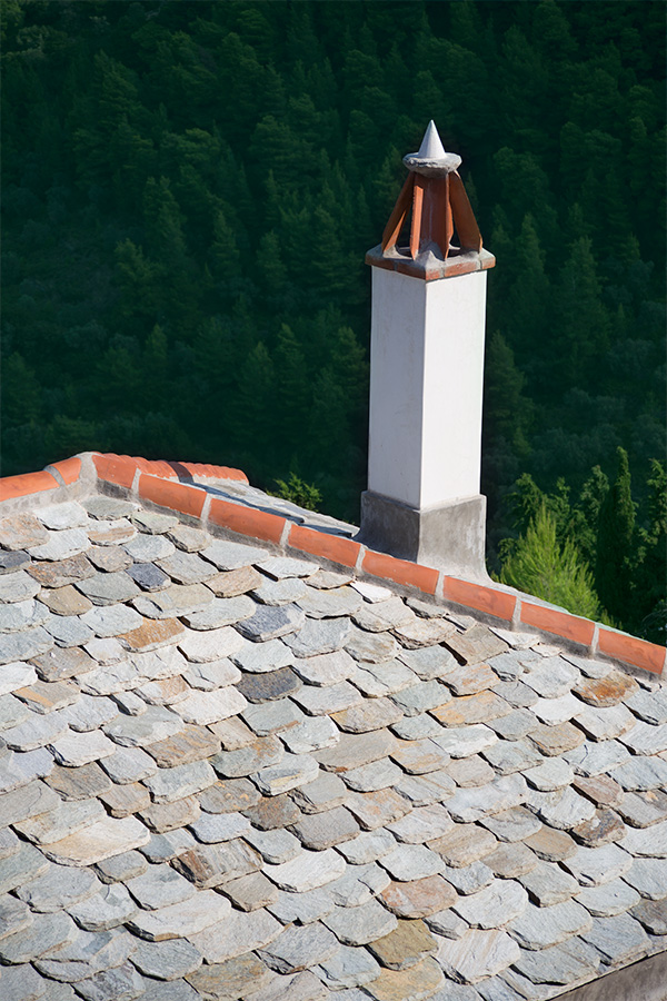 handworked slate tiles to roof with traditional carrot chimney detail