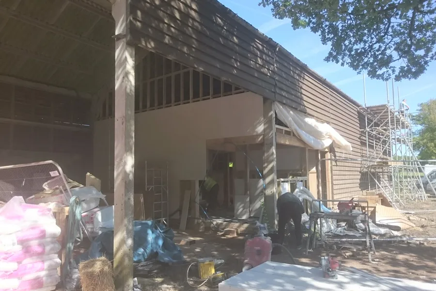 view from outside barn, under construction