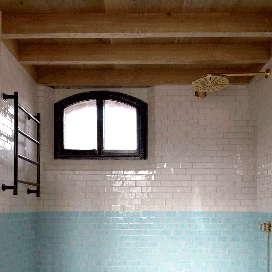 bathroom with handmade terracotta tiles and oak soffit
