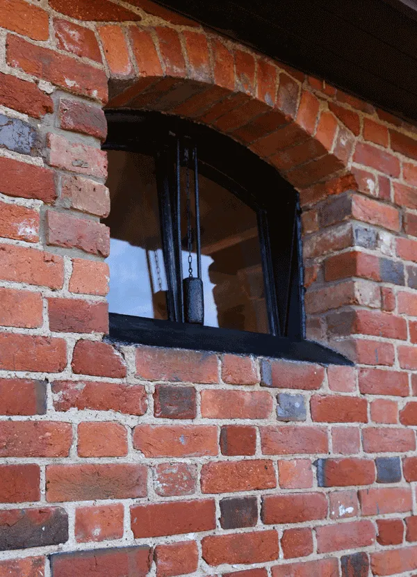 old steel stable window with cast counterweight