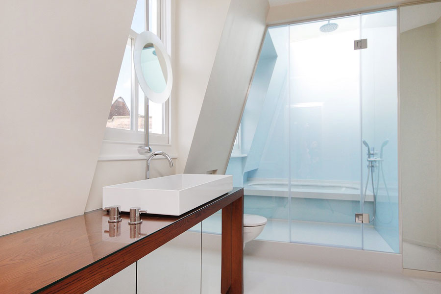 marble walls beside walk-in shower