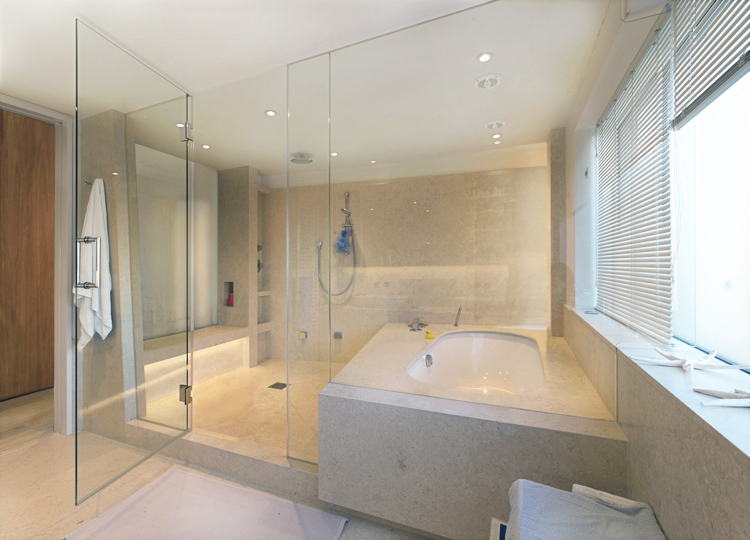 limestone wetroom with steam, bath and shower