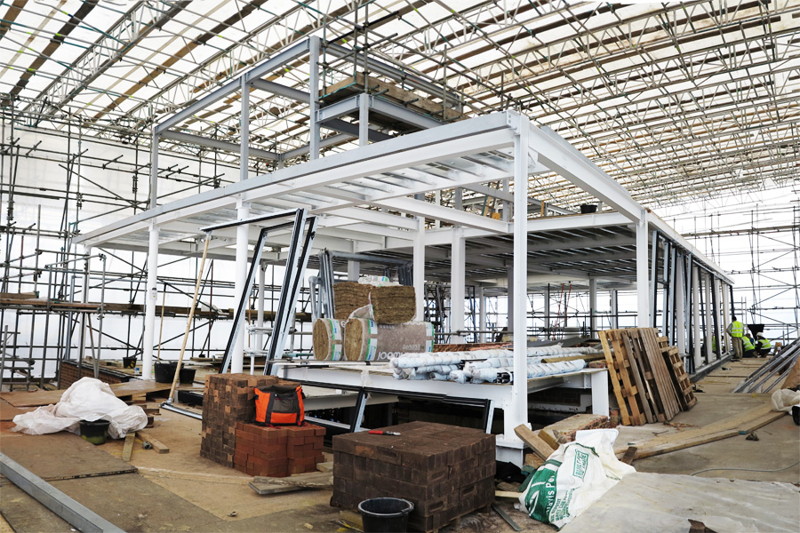 steel frame under construction, below scaffold