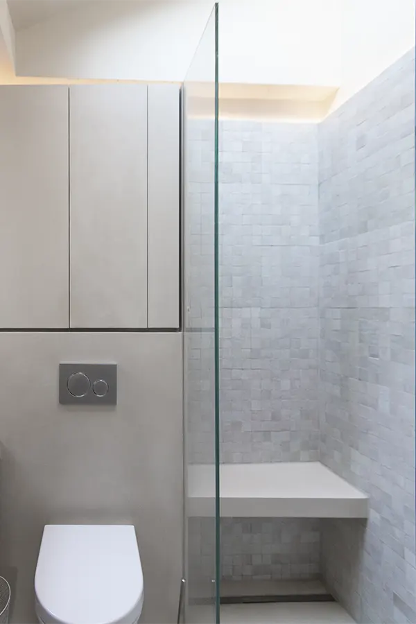 bathroom with polished plaster and moroccan zellige tiles in shower
