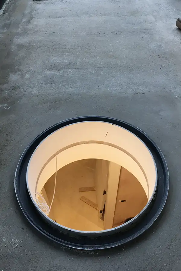 circular rooflight opening on flat roof under construction