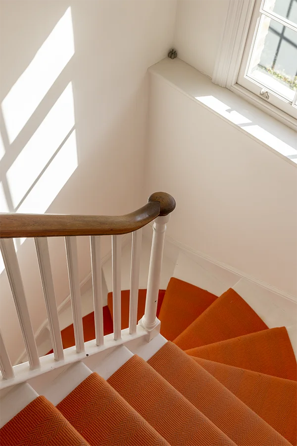 orange runner on original stair winder and sash window