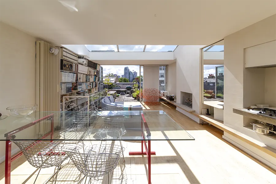 view to roof terrace close to Thames, with glass dining table in foreground