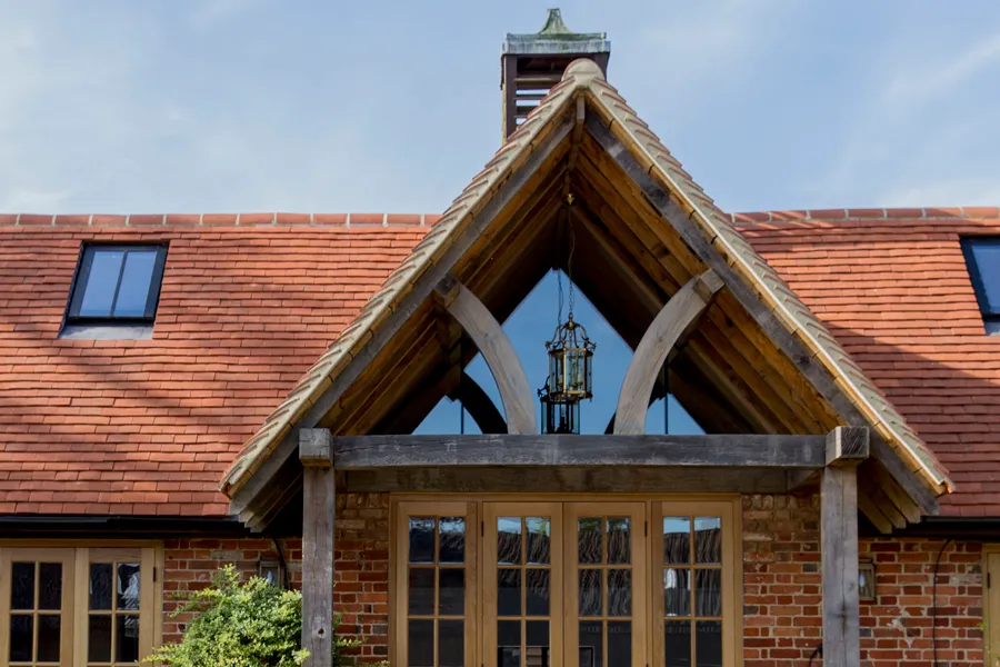 Oak gable porch and terracotta tiled roof