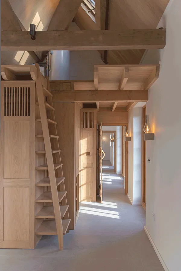 Oak interior with ship's ladder and lanterns