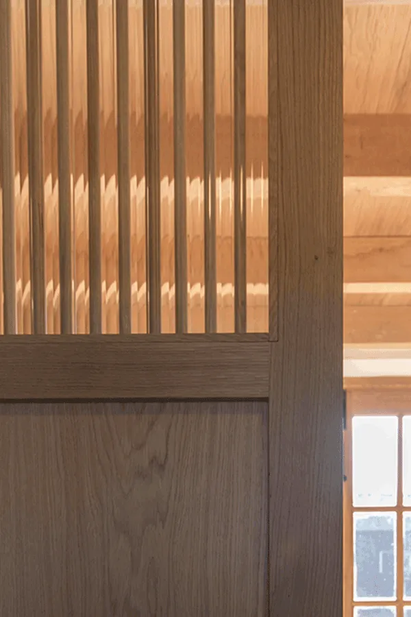 Wooden partition with reeded glass