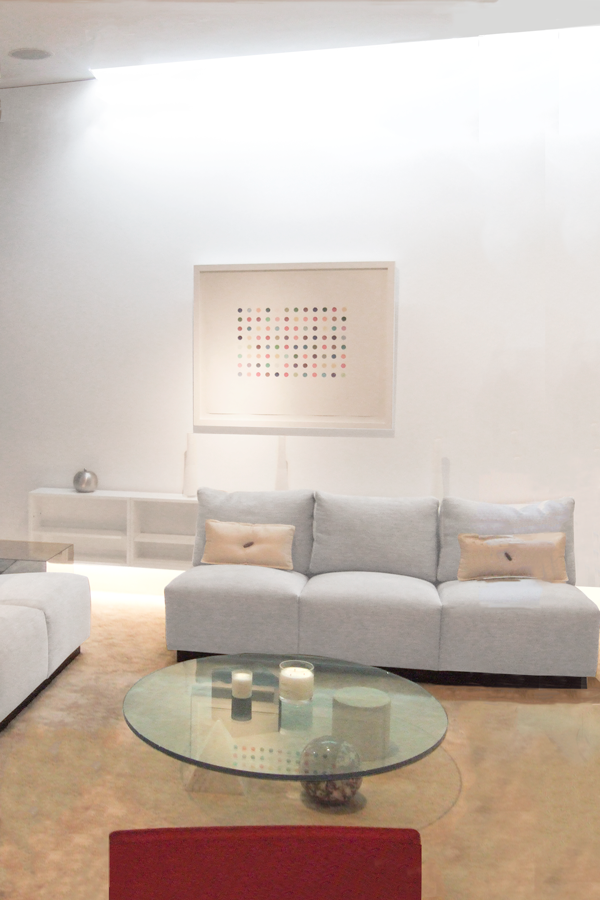 Living room with false skylight along the party wall