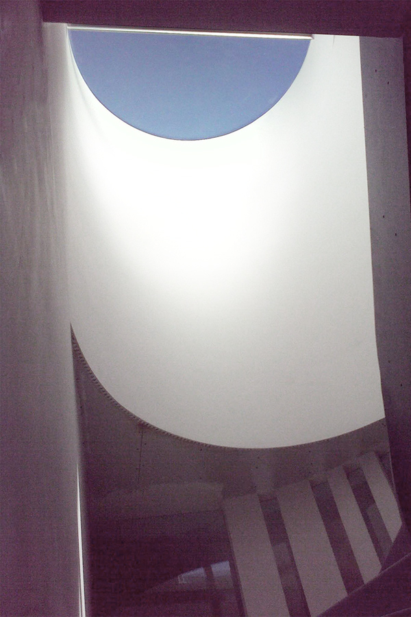 Round rooflight lighting the staircase