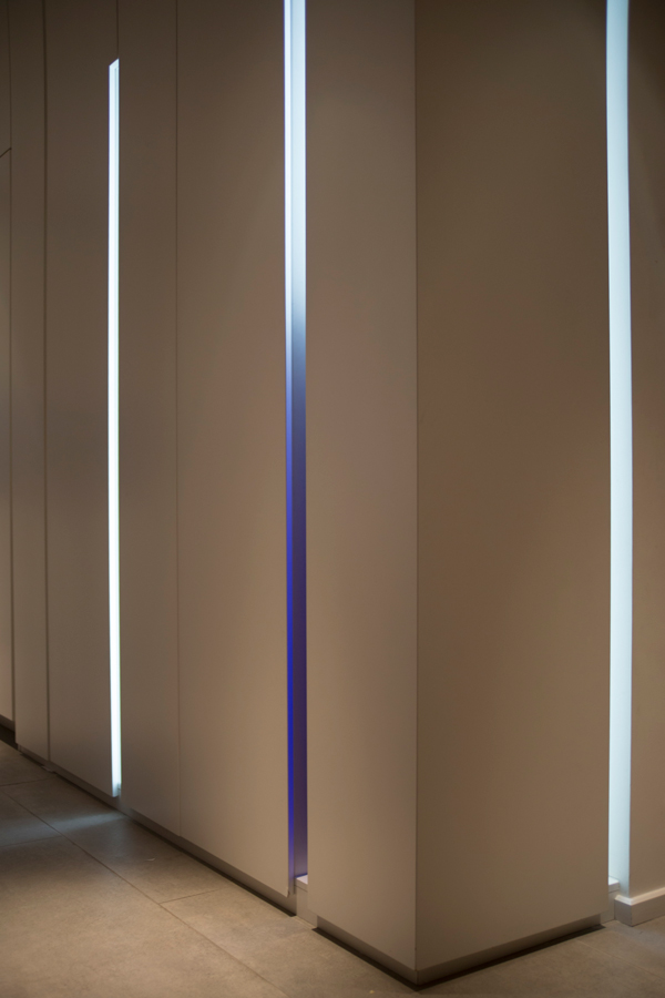 3 vertical light slots concealing the air conditioning