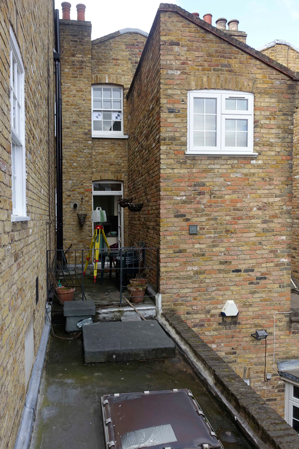 Rear elevations showing existing narrow rear additions in brick