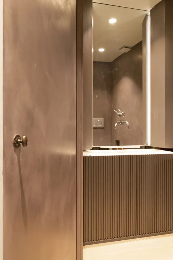 Guest wc with mirror-mounted tap, before installation of counter and basin