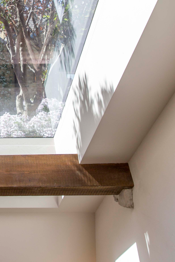 Historic beam on stone corbel, below rooflight