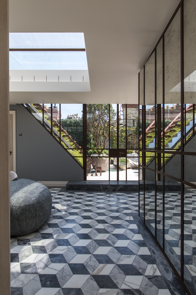 Top-lit entrance hall with roof terrace beyond