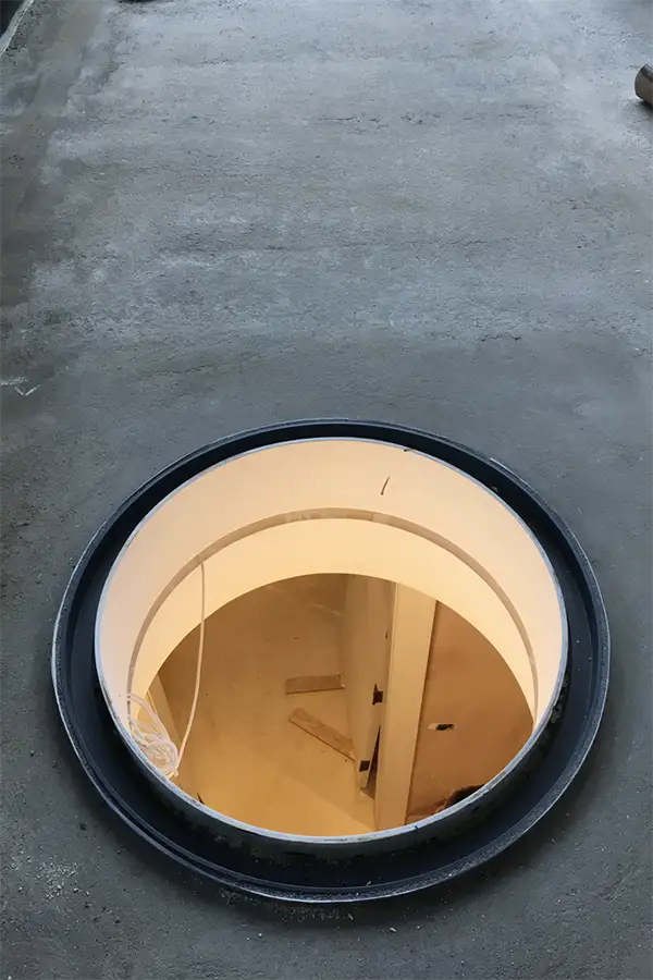 Circular rooflight opening on flat roof under construction