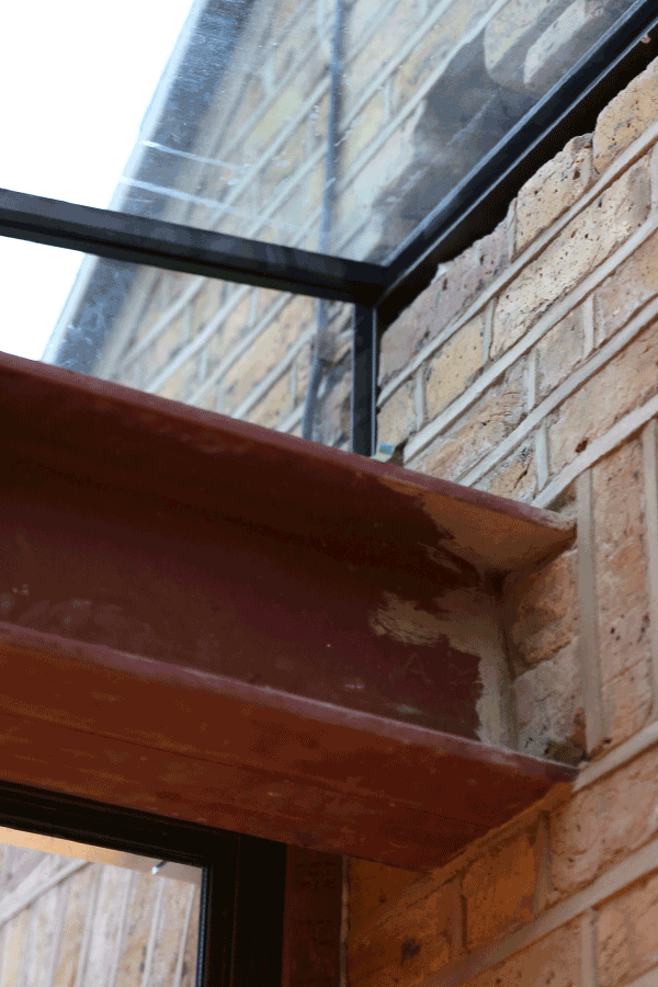 Steel beam brick wall junction