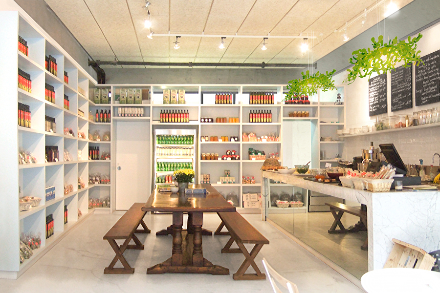Delicatessen with marble floor and concrete strip at the top of the wall