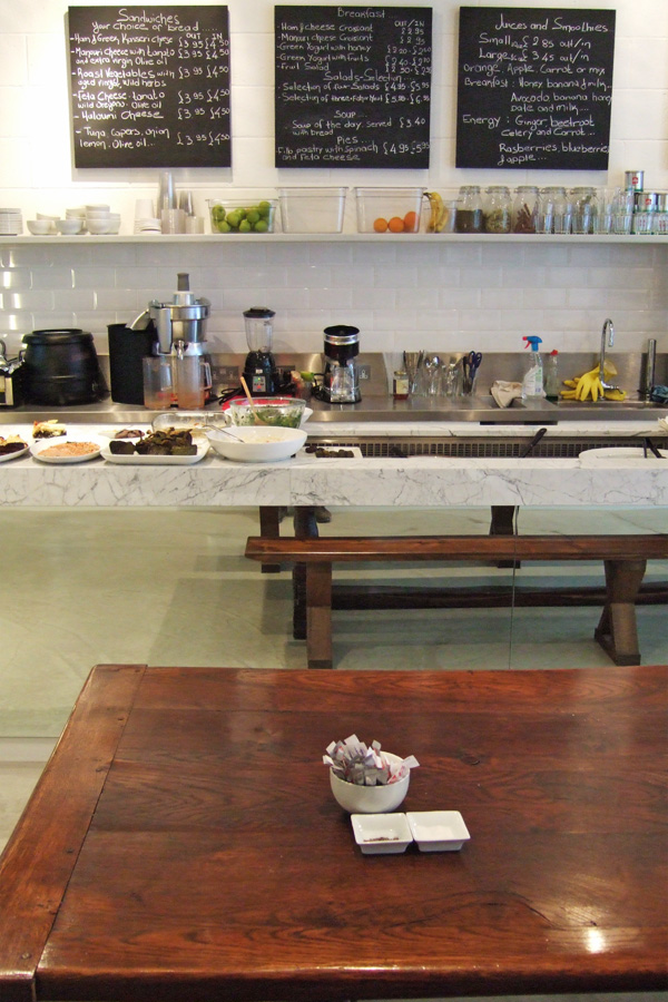 Reflection of the wooden table in the mirror's counter