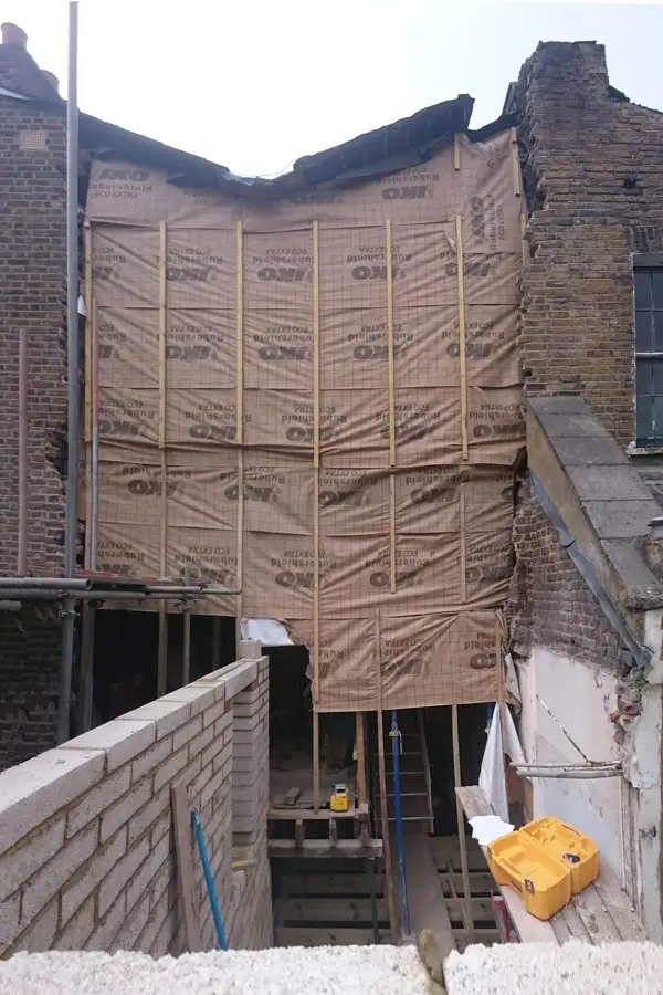 Rear elevation of victorian terraced house with rear addition temporarily demolished