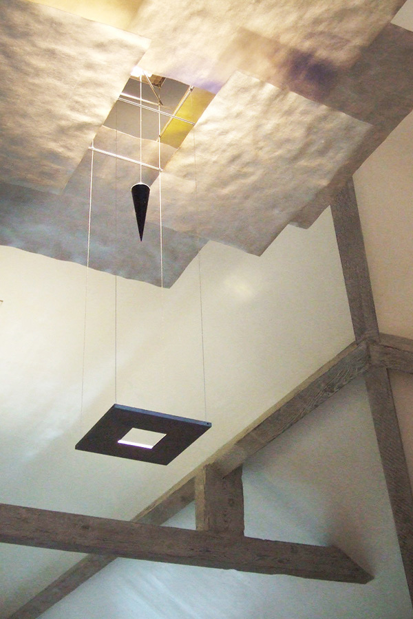 Timber beams paired with a contemporary design light fitting