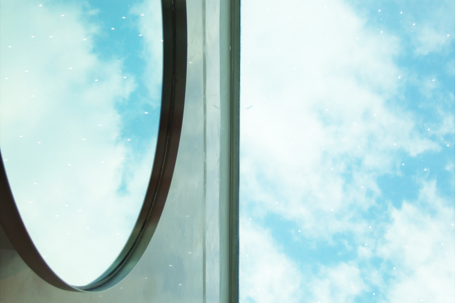 A sky reflection framed by a circular window