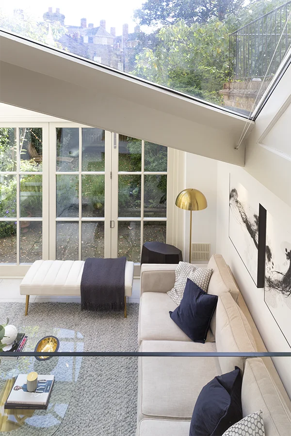 View onto conservatory sofa and garden, from dining area