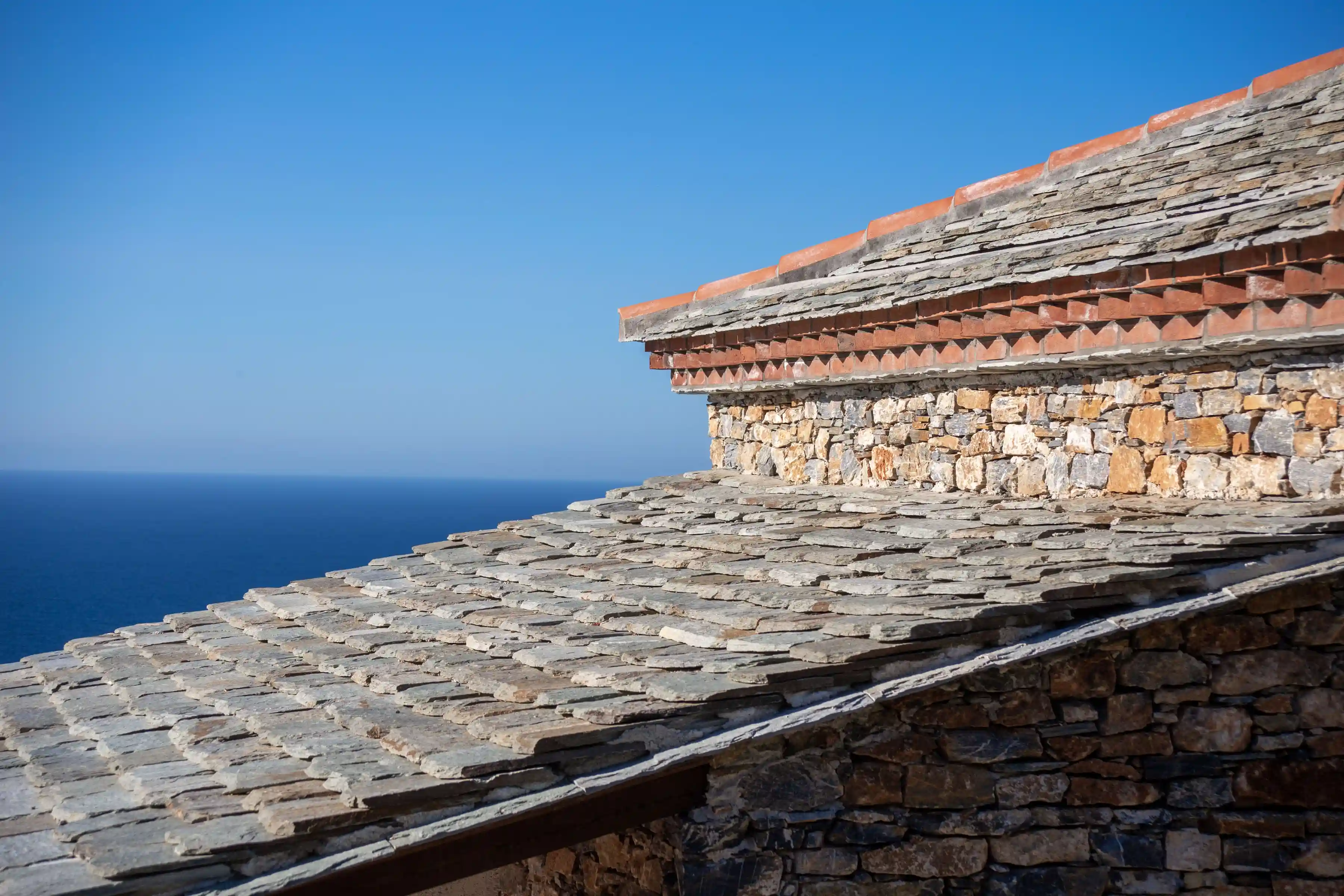 Slate roof detail with traditional brick cornice