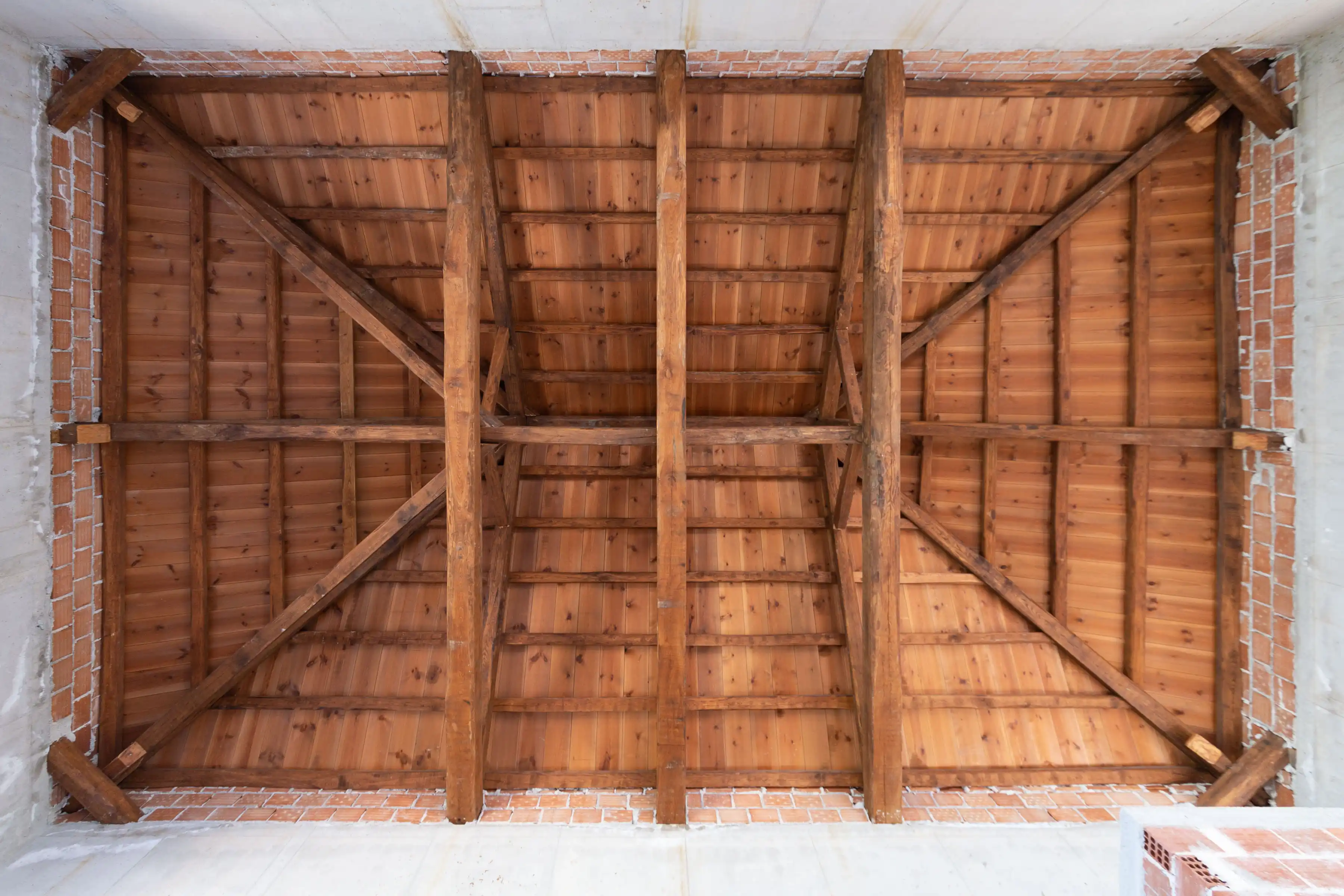 Completed timber roof structure viewed from below
