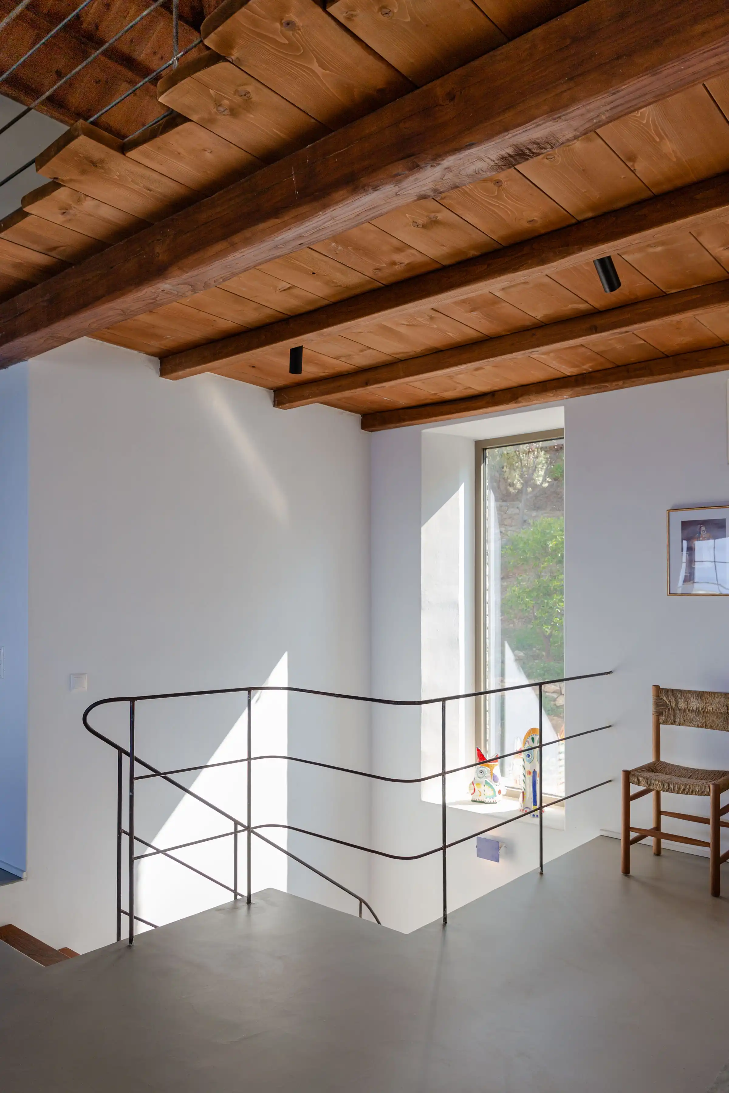 Stone House Skopelos - steel balustrade and timber patari to main house