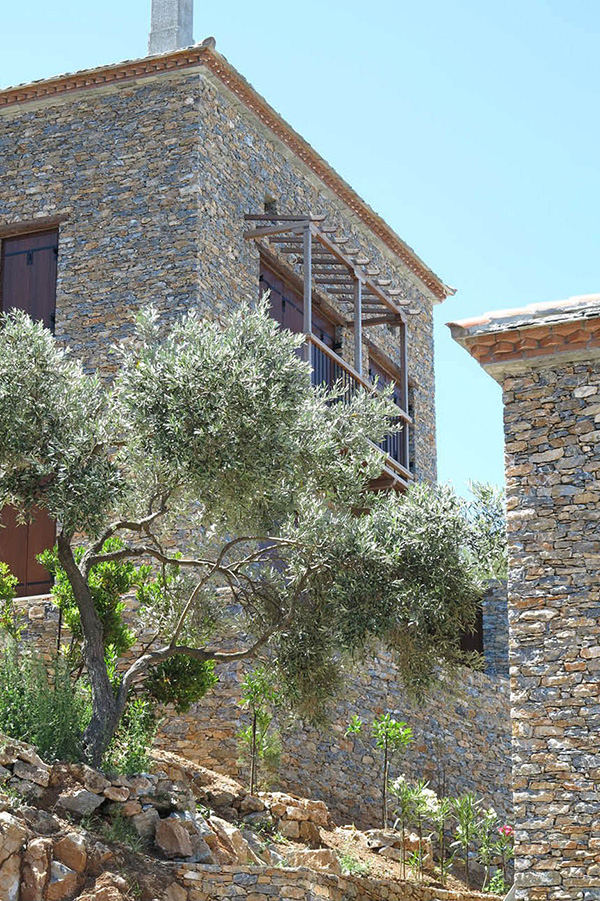 Stone facades and timber balcony