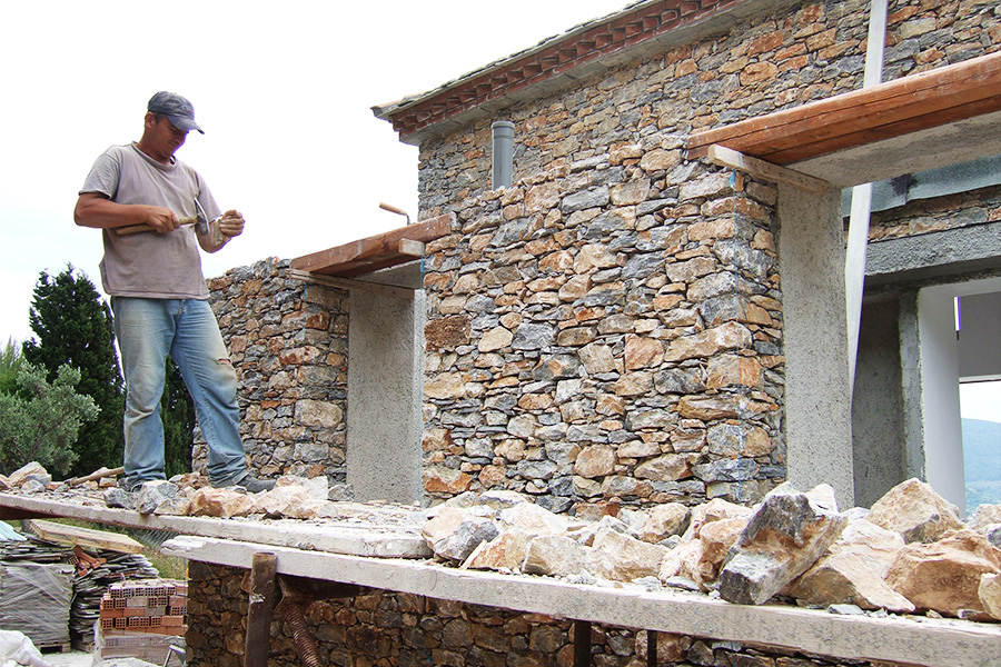 Stone masons at work on the facade
