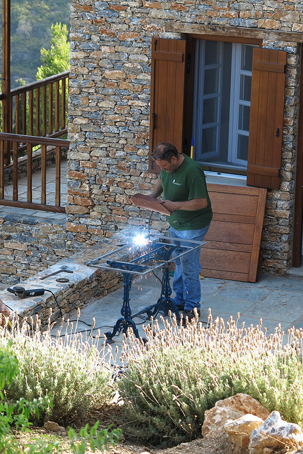 Metalworker welding on site