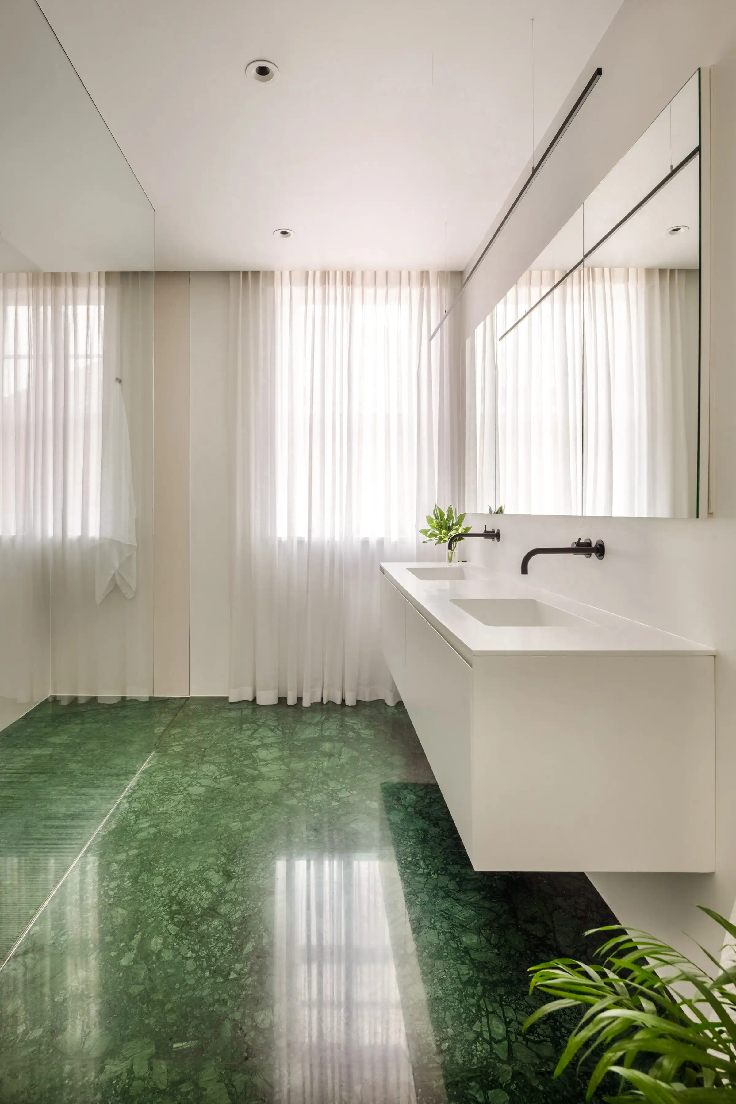Master Bath at Staverton Road Oxford — green marble to the floor