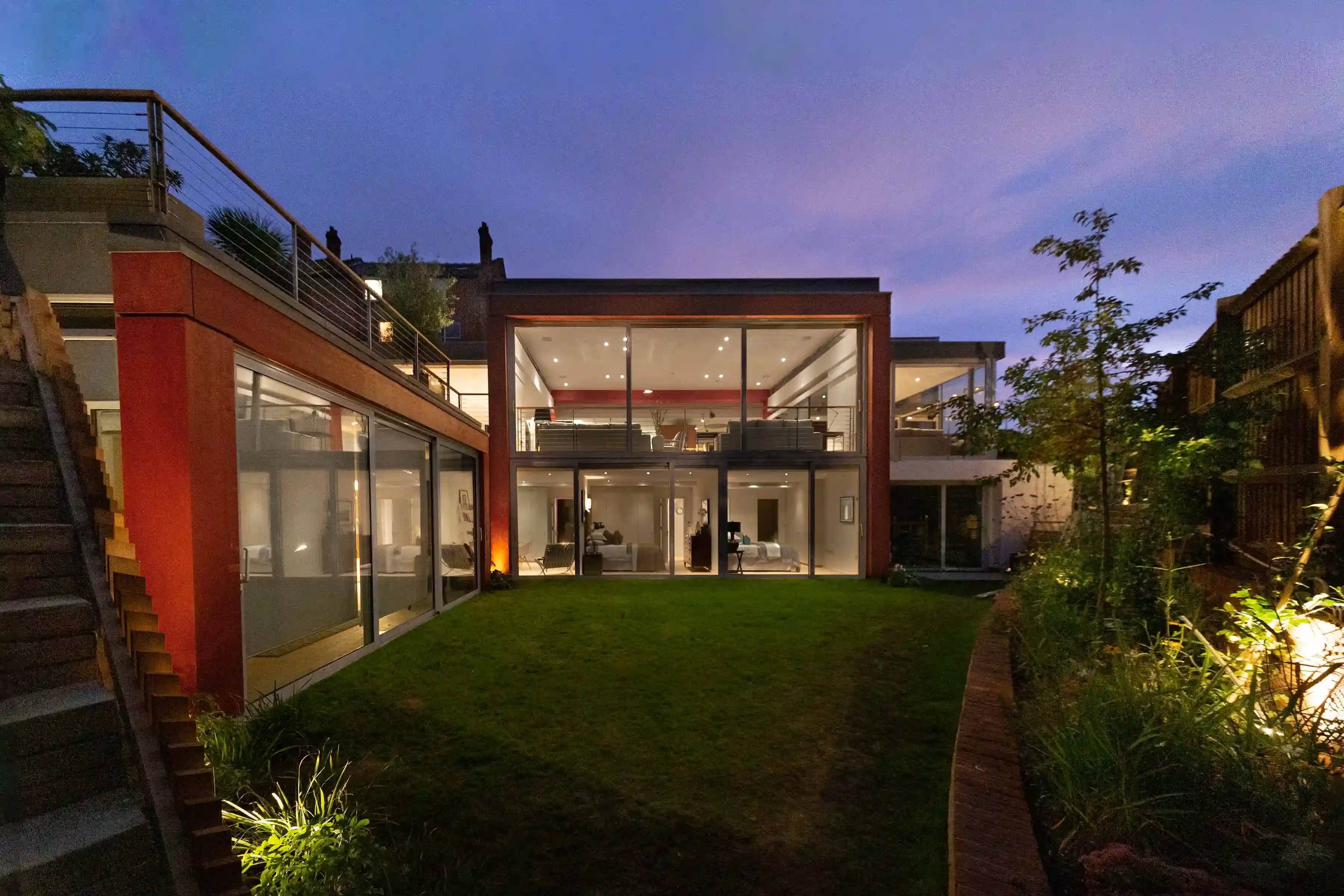 View from garden to house at dusk